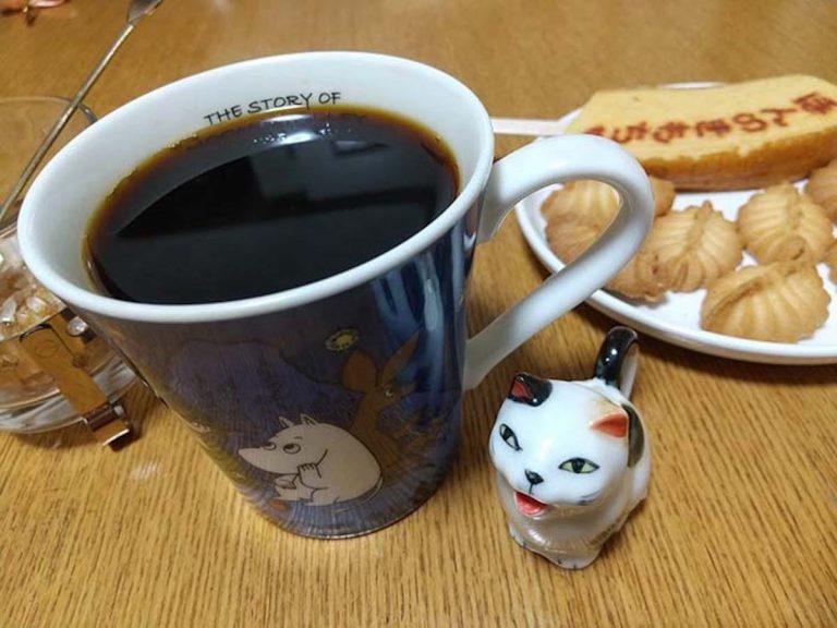 Cute cat milk jug puking in a cup of coffee has Twitter users grossing out