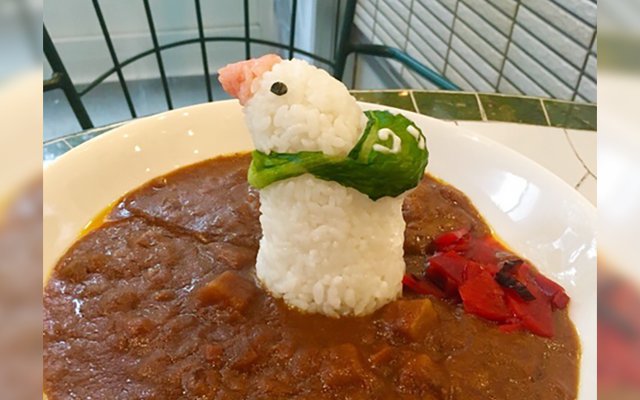 Bird Carrying Traditional Furoshiki Bag Stands Tall In Japanese Curry Plate