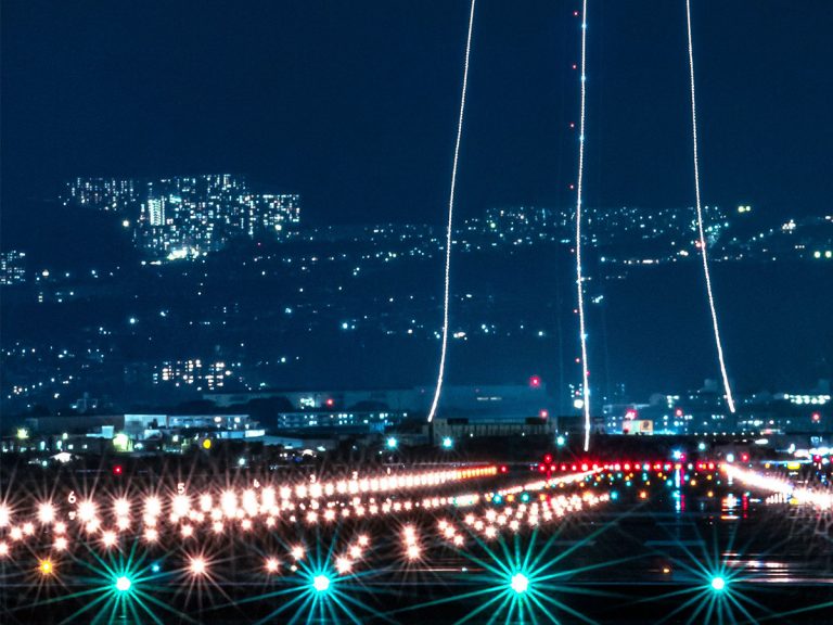 Photographer perfectly times magical shot of nighttime airport