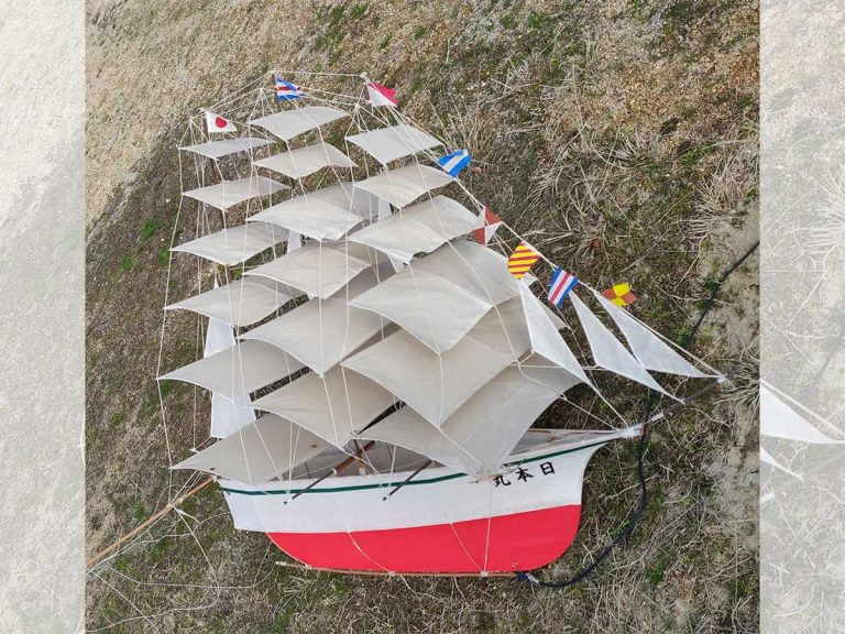 In a fantasy come to life, a realistic sailboat kite soars above the skies of Japan