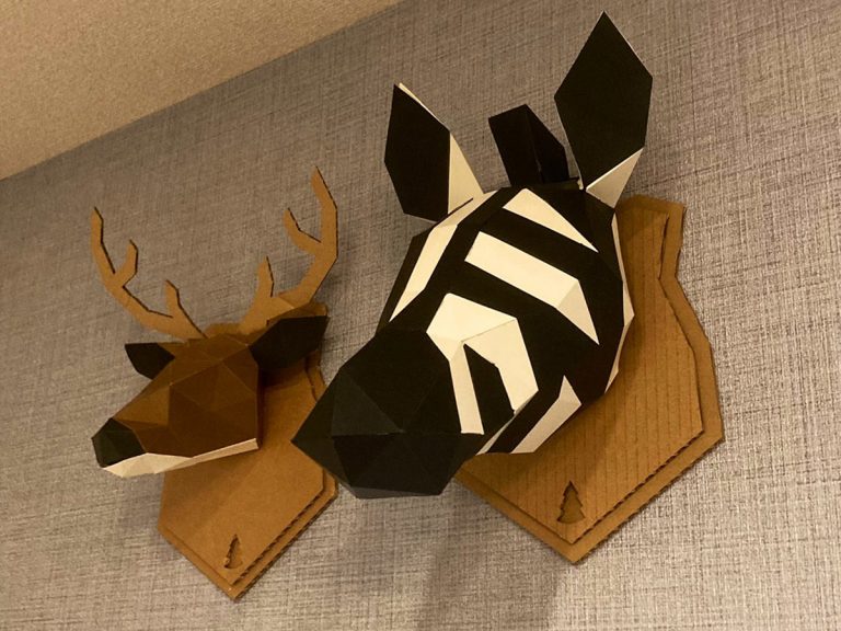 Son surprises father with papercraft animal head decorations