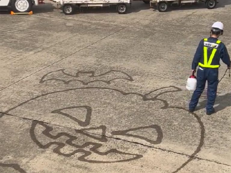 Japanese runway workers go the extra mile with Halloween art to cheer up passengers