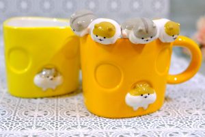 Adorable peeking hamster face and butt mugs make for a cheeky tea time
