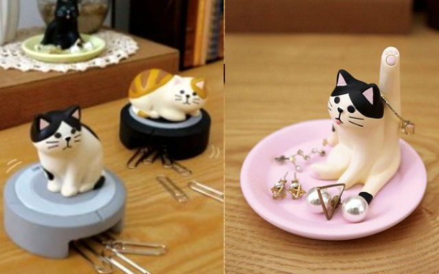 Paperclip and jewelry holders modeled after cats on vacuums and caught mid-grooming