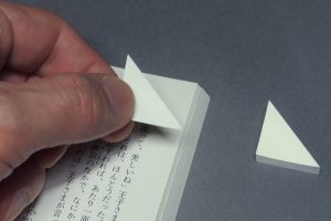 Designer’s too clever bookmark dog-ears pages without actually doing it