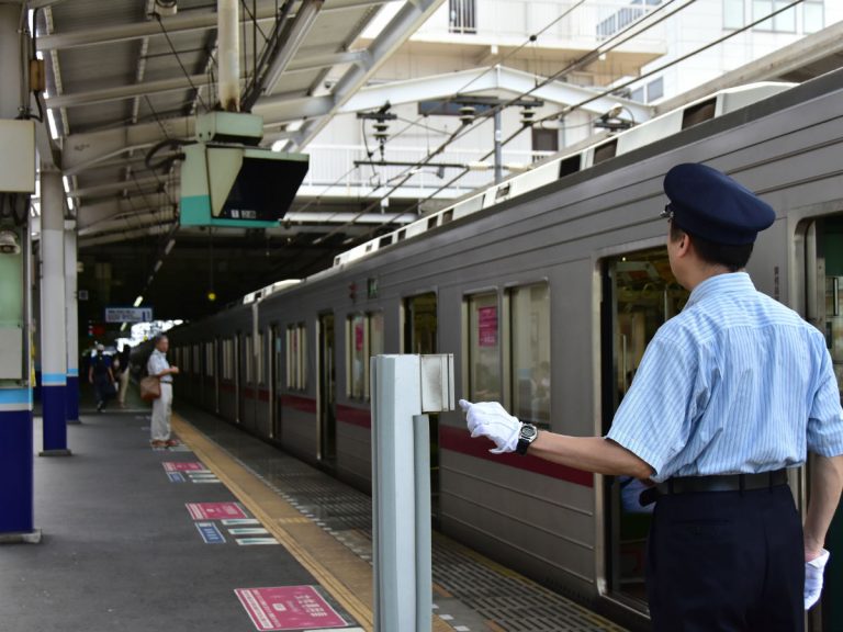 Duo of train conductors in Japan sync up for idol dance during safety check