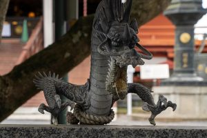 Dragon god seemingly stunned by sudden temple decorations in Japan