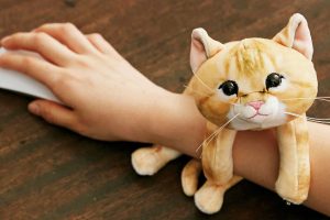 Japanese Clingy Kitten Arm Rests Give You A Feline Friend Who Refuses To Let Go